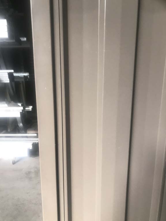 Powder coated gate frame with colorbond sheet and gate strip fitted
