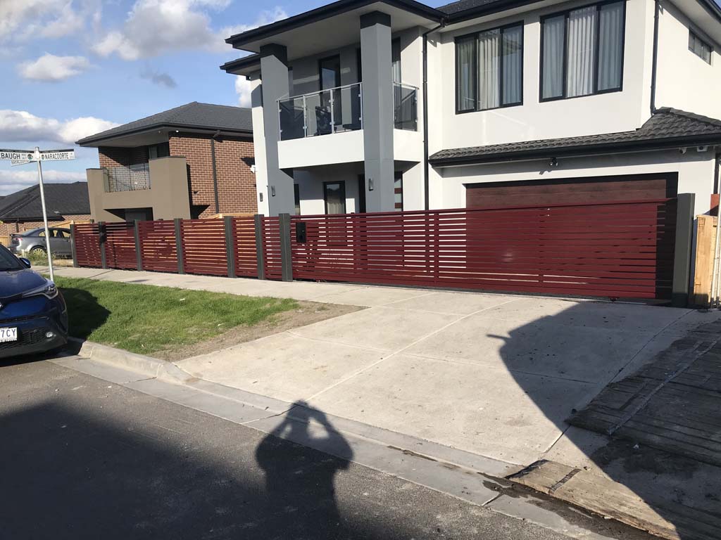 Slat fence wollert federation red with sliding gate automated